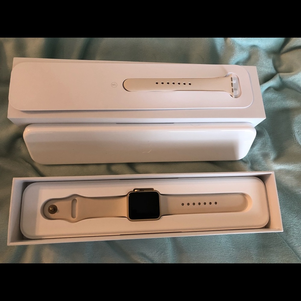 Apple Watch with extra bands and charging stand